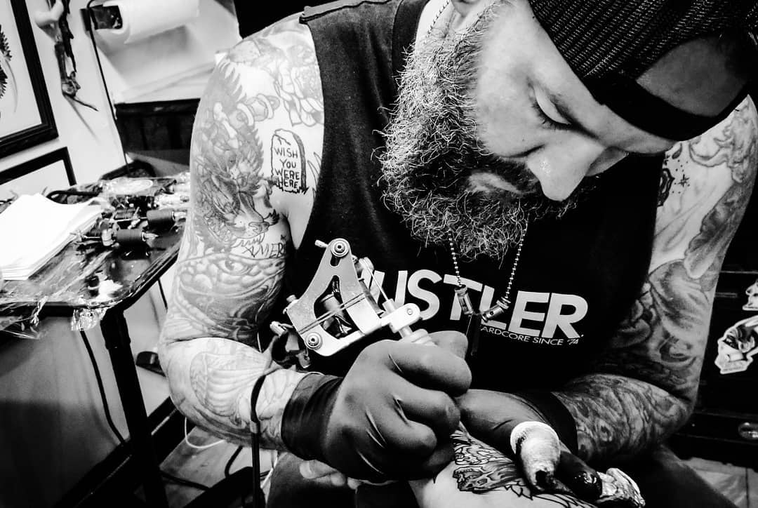 Milwaukee tattoo artist Mike D tattooing