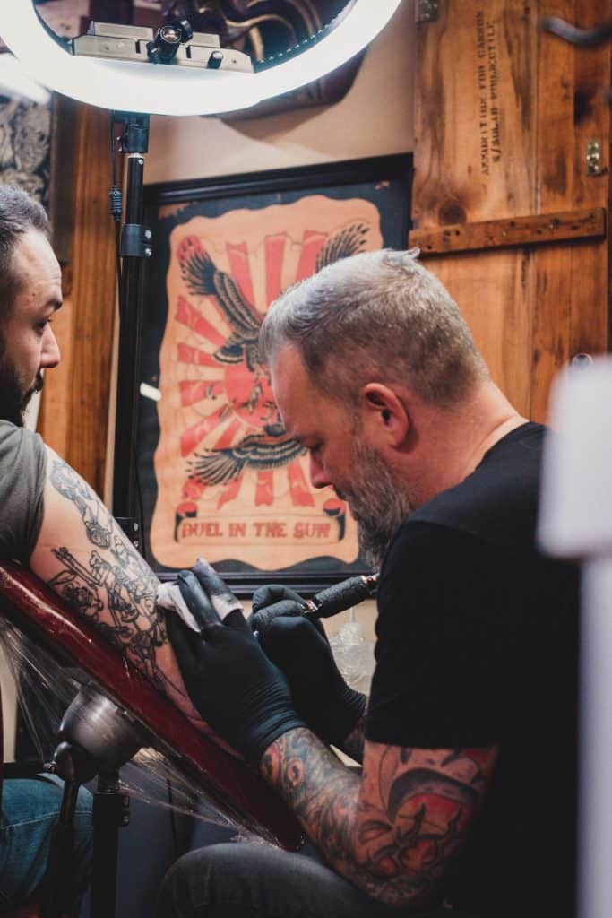 Milwaukee tattoo artist Mike Davenport tattooing